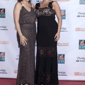 Black lace and spandex gown with feather details